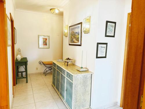 a hallway with a counter in a room at Plaza Real - Silhueta Citadina in Portimão