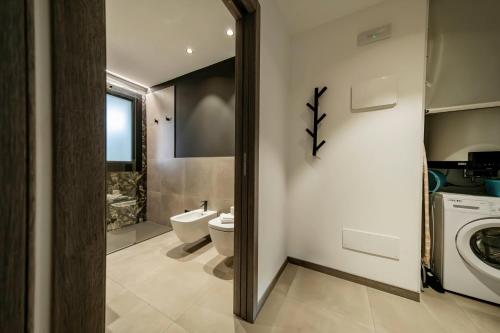 Bagno di ApartmentsGarda - Residenza Garda Deluxe