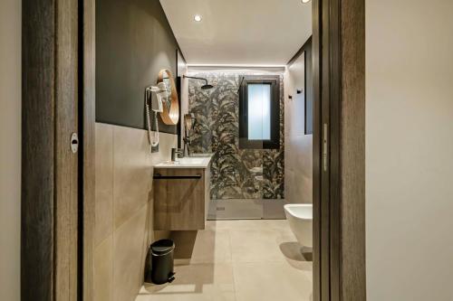 Bagno di ApartmentsGarda - Residenza Garda Deluxe