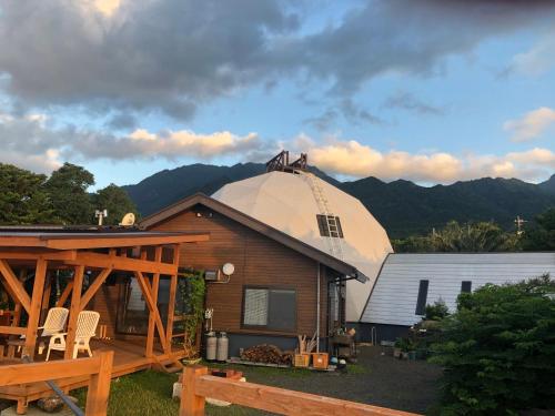 a house with a domed observatory on top of it at Takahira Base in Yakushima