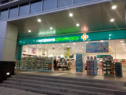 a store front of a pharmacy with stairs in front at Mactan Newtown 8 Boulevard Deluxe Ocean View in Lapu Lapu City