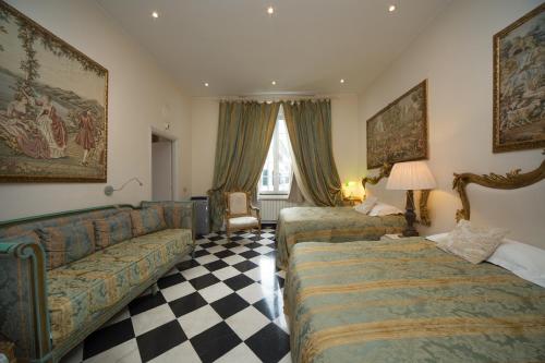 a bedroom with a large bed and a large window at San Giorgio Rooms in Genoa