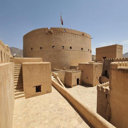 a view of a building in the desert at SABKHA Apartment in Nizwa