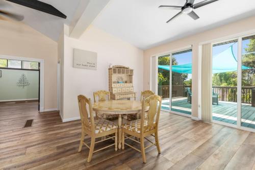 a dining room with a table and chairs at Family-friendly cottage with lake access in Chippewa Lake