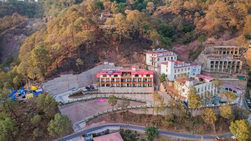 an aerial view of a building on a mountain at The Sanawar Heights I Kasauli I New Property in Kasauli