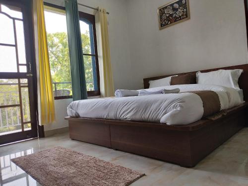 Postel nebo postele na pokoji v ubytování Spring Inn Bir-Billing