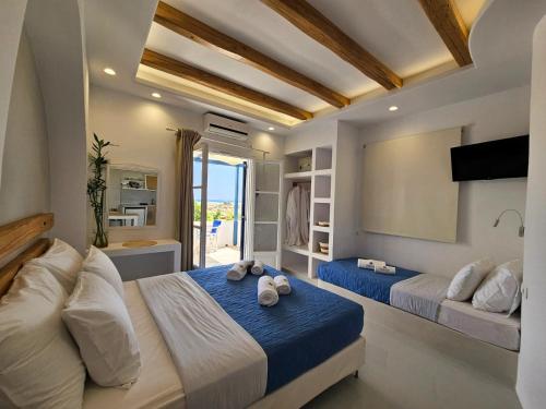 Posteľ alebo postele v izbe v ubytovaní Coralli Beach Apartments
