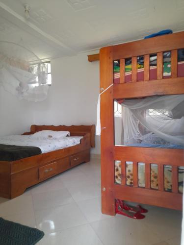 Vuode tai vuoteita majoituspaikassa Maasai Villa Backpackers Home