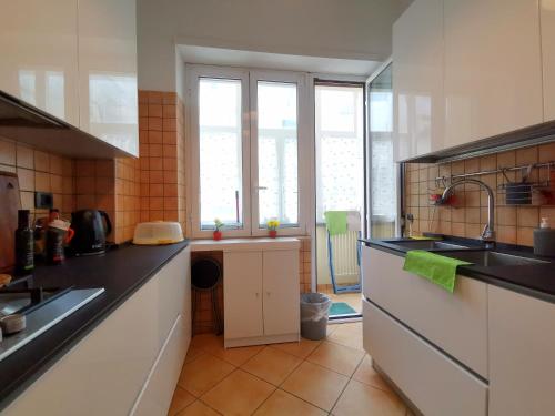 a kitchen with a sink and a counter top at Cipro Home in Rome