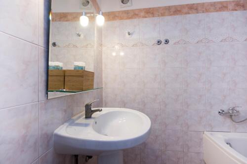 a bathroom with a sink and a mirror at Villa Baronnos in Gaios