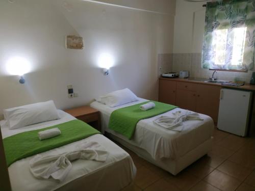 Postel nebo postele na pokoji v ubytování Lia Sofia Apartments