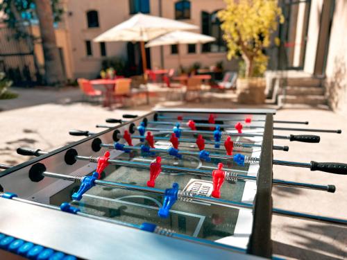 a ping pong table with red birds on it at Ostello Bello Palermo in Palermo