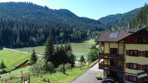 a building with a view of a river and mountains at Apartmán Olívia 8 Hrabovská dolina in Ružomberok