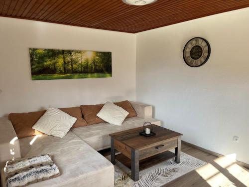 a living room with a couch and a table at Ferienhaus Deutschmann Sankt Lambrecht in Sankt Lambrecht