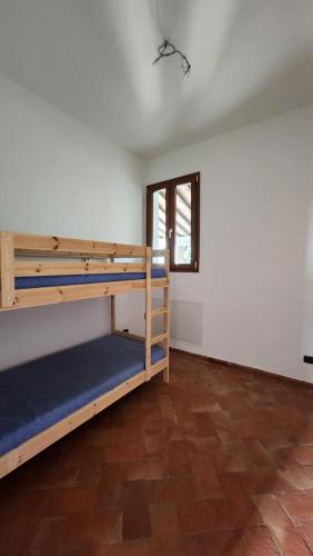 Ένα ή περισσότερα κρεβάτια σε δωμάτιο στο Villa Belfiore
