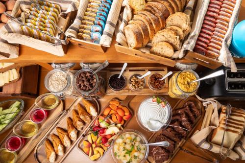 a table filled with lots of different types of food at Bella Vista Beach Hotel in Benitses