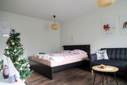 Un ou plusieurs lits dans un hébergement de l'établissement Rovaniemi City Centre Apartments