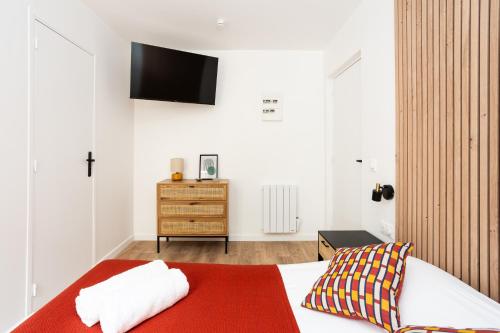 Postel nebo postele na pokoji v ubytování Maison Geranium