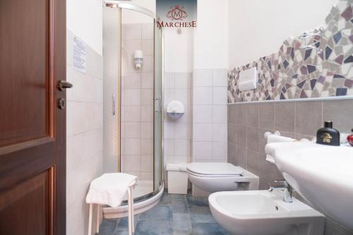 a bathroom with a sink and a toilet and a shower at Il Marchese Hotel & Spa in Sciacca