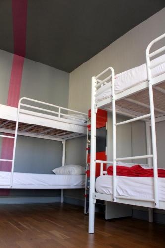 a room with two bunk beds in a room at Arty Paris Porte de Versailles by River in Paris