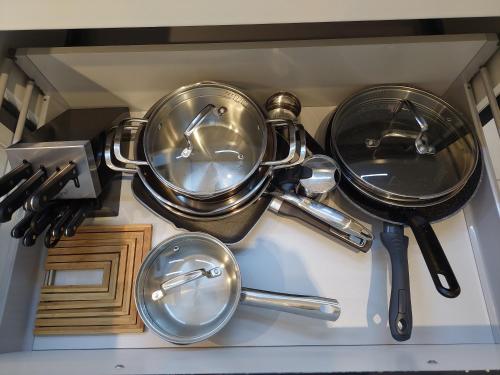 a bunch of pots and pans sitting on top of a stove at Lucia Exclusive with parking in the garage in Poreč