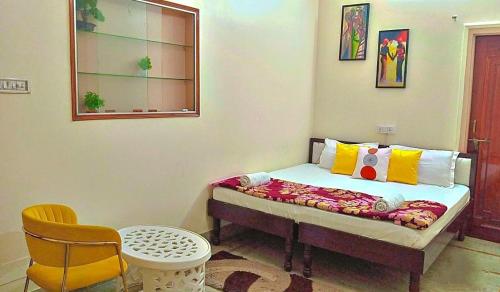 a small bedroom with a bed in a room at Serene Stays at Varanasi - 2BHK Luxury Villa in Varanasi