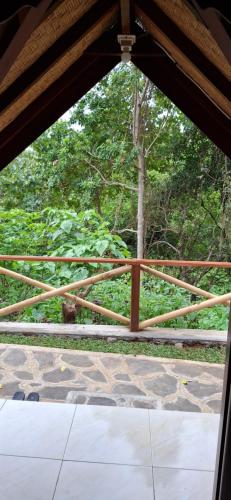 a view of a wooden fence from a patio at Uma Nirmala Aling-Aling in Singaraja