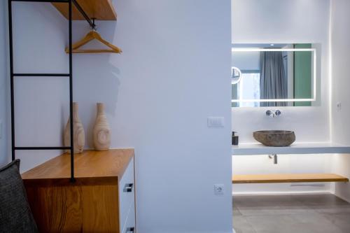 a bathroom with a sink and a mirror at VILLA PANAMERA Mykonos, Private Heaven, Supreme View! in Fanari