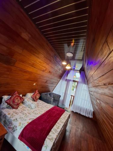Una cama o camas en una habitación de Langit dieng cabin