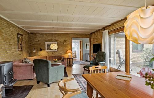 a living room with a couch and a table at Pet Friendly Home In Bandholm With Wifi in Bandholm