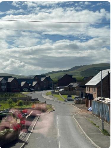 an empty street with houses in a small town at Birks road in Cleator Moor