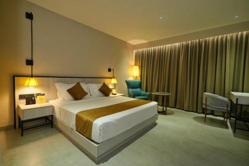 Una cama o camas en una habitación de mesta Hotel