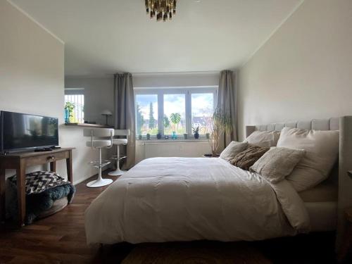 Postel nebo postele na pokoji v ubytování Design Apartment Nähe Düsseldorf