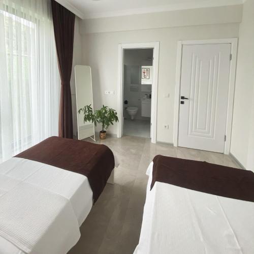Ένα ή περισσότερα κρεβάτια σε δωμάτιο στο High Garden Villas
