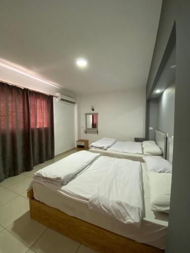a bedroom with two beds and a window at Jasmine Resort & Aqua park in Sharm El Sheikh