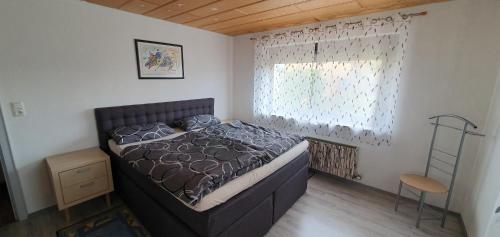 Katil atau katil-katil dalam bilik di Ferienwohnung Rettersheim Mainspessart