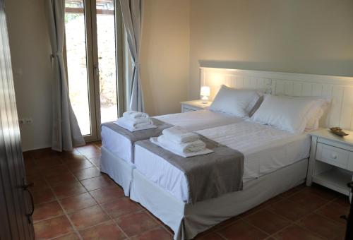 Ένα ή περισσότερα κρεβάτια σε δωμάτιο στο Arriva Villas