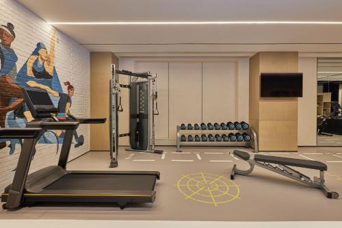 a fitness room with a treadmill and a gym at Four Points by Sheraton Chengdu, High-Tech Zone Exhibition Center in Chengdu