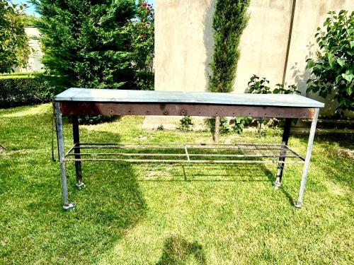 a table sitting on the grass in the yard at Villa Lux in Quba in Quba