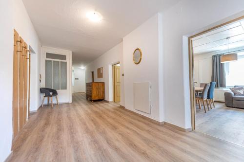 an empty living room with a couch and a table at Central Apartments Cristlpek in Ortisei