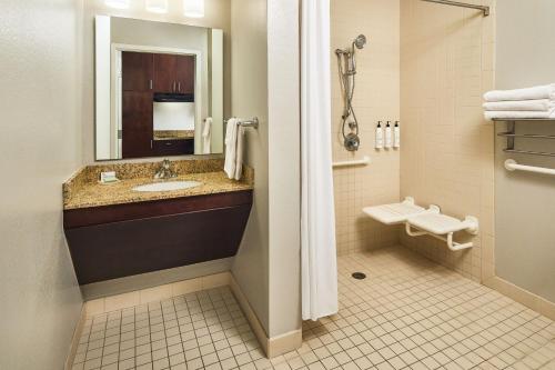 a bathroom with a sink and a toilet at TownePlace Suites by Marriott Garden City in Garden City