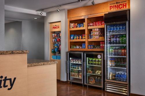 a grocery store with two refrigerators in a store at TownePlace Suites by Marriott Garden City in Garden City