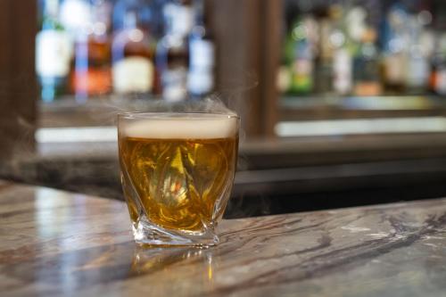 a glass of beer sitting on a table at Sky Rock Sedona, a Tribute Portfolio Hotel in Sedona