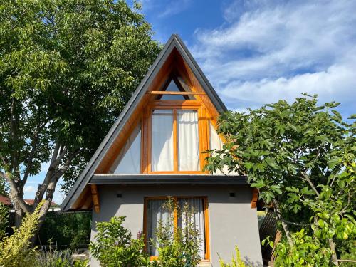 a small house with a gambrel roof at Petrovaradin Chalet in Novi Sad