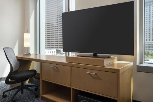 a television on a desk in a hotel room at Courtyard by Marriott Los Angeles L.A. LIVE in Los Angeles