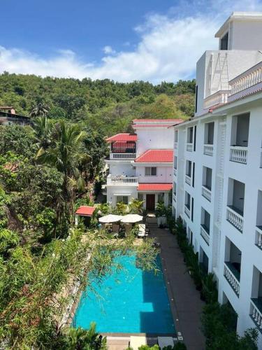 an aerial view of a hotel with a swimming pool at 1Bed Field View Penthouse in Assagao by Masaya stays in Bardez