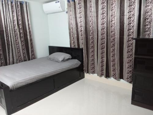 Katil atau katil-katil dalam bilik di Penthouse in Sylhet
