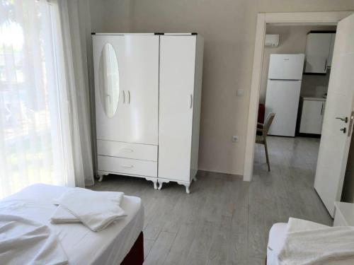 Ένα ή περισσότερα κρεβάτια σε δωμάτιο στο Palmiyem Apart Otel