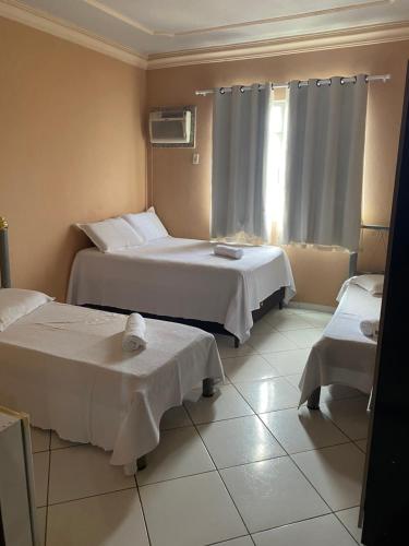 Ένα ή περισσότερα κρεβάτια σε δωμάτιο στο Hotel Eldorado de Salinas