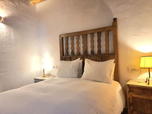 En eller flere senge i et værelse på La Placeta Guesthouse
